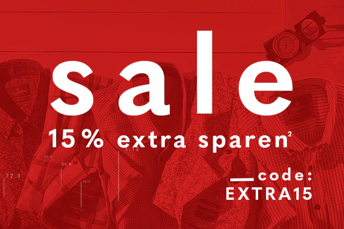 Banner mit 15% extra sparen und dem Code EXTRA15 vor liegenden Hemden