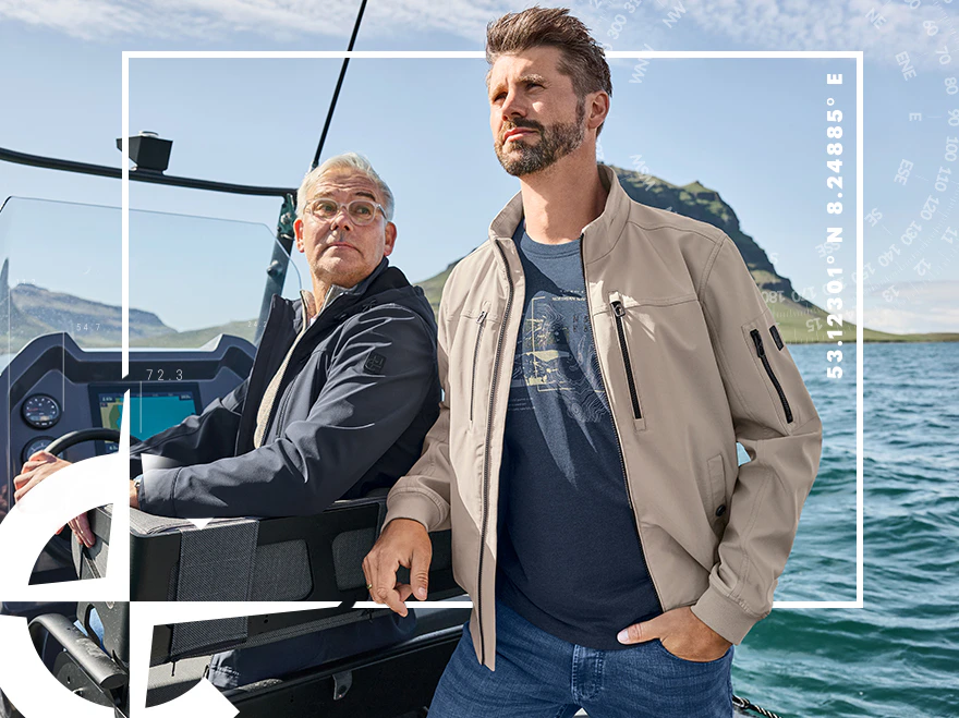 Zwei Männer auf einem Boot, Mann im hellen Blouson und Mann in blauer Jacke