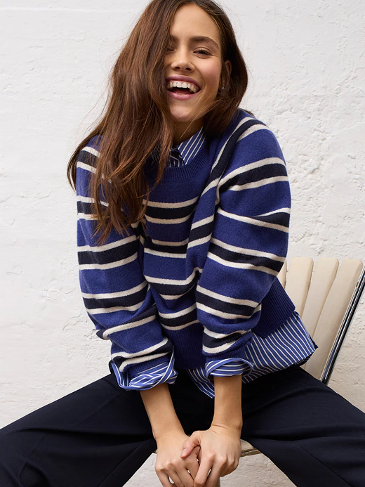 Women’s fashion from Oui, featuring a striped knitted jumper, a striped blouse and trousers