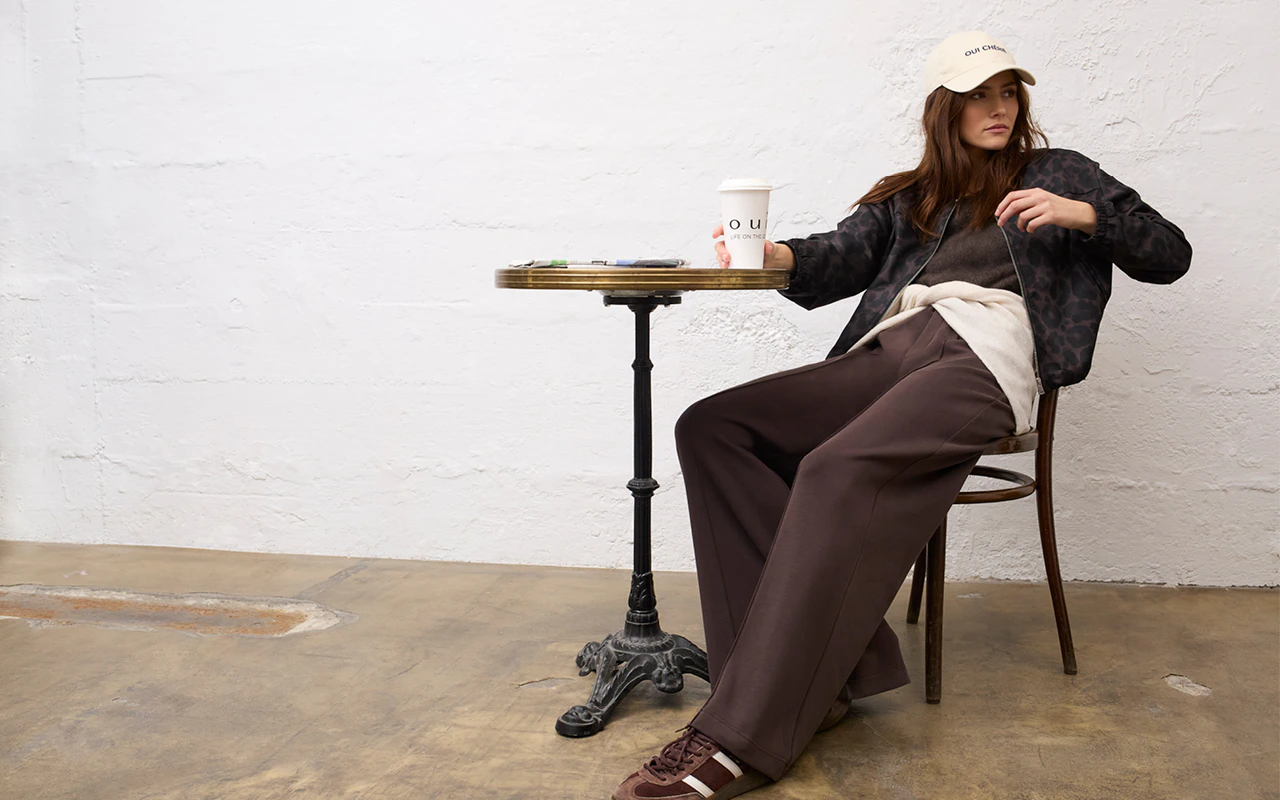Women’s fashion from Oui, featuring a leopard-print jacket, a knitted jumper, a cardigan and trousers.
