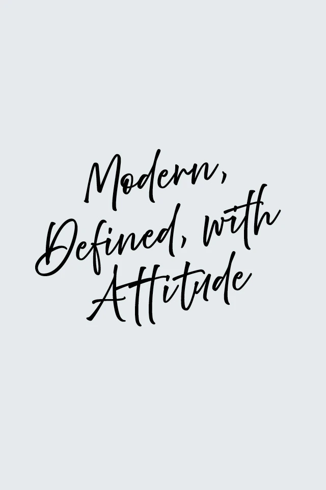 Quote on grey surface: Modern, Defined, with Attitude.