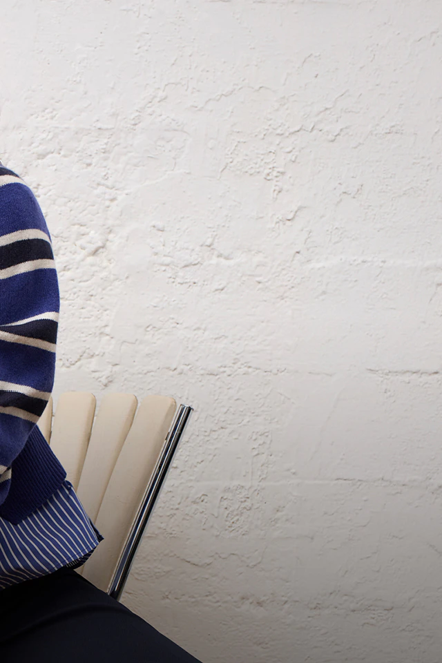 Women’s fashion from Oui, featuring a blue, white and black striped jumper and blouse from the current collection