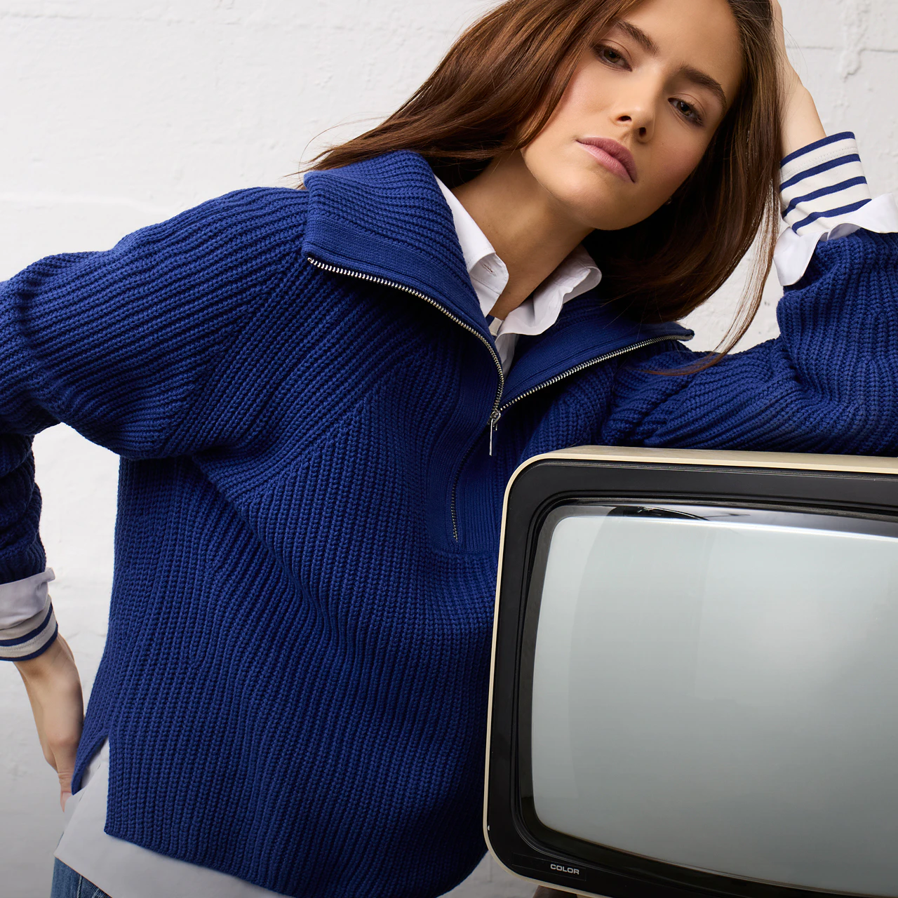 Women’s fashion from Oui, featuring a striped long-sleeved T-shirt, a blouse and a blue crew-neck jumper.