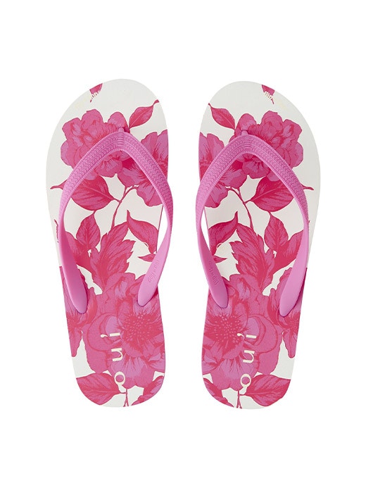 A pair of flip*flops with a pink floral pattern and pink straps.