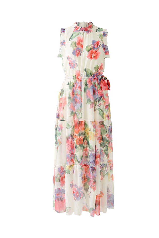 A maxi dress with a white base colour and a beautiful rose print on top.