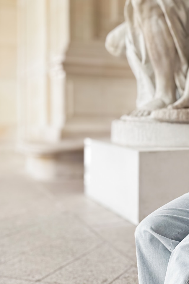 Lena Terlutter wears our colourful BLock stripe cardigan with light blue jeans.