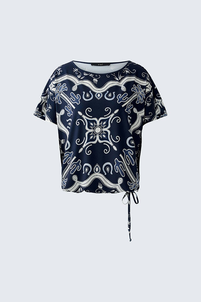 A blouse with a drawstring hem in dark blue with a white print.