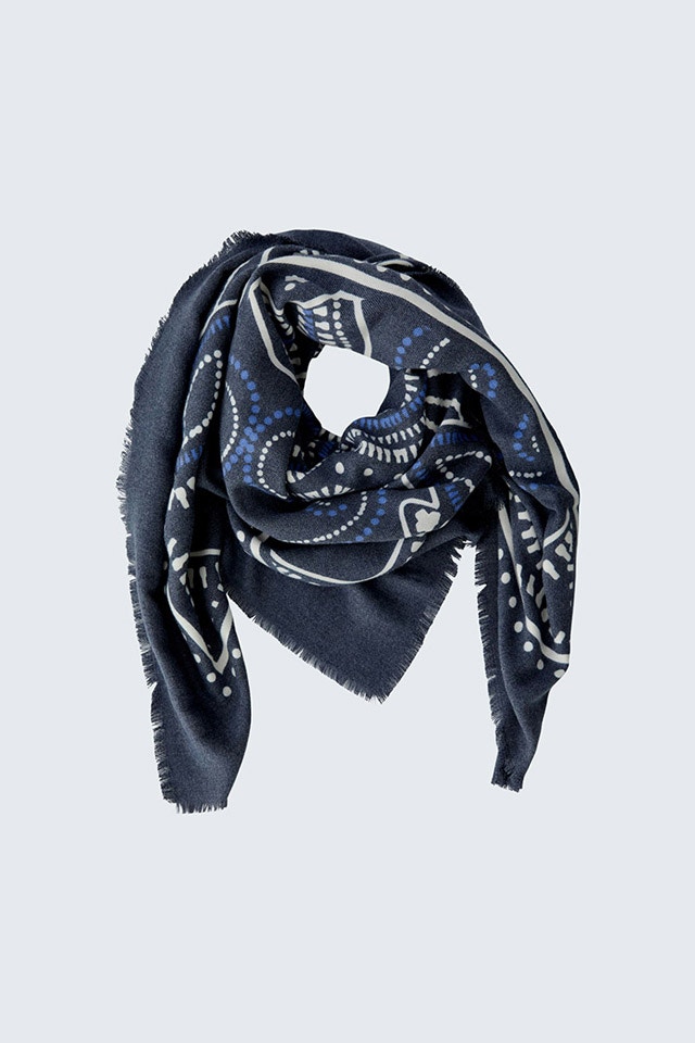 A scarf in dark blue with a white print.
