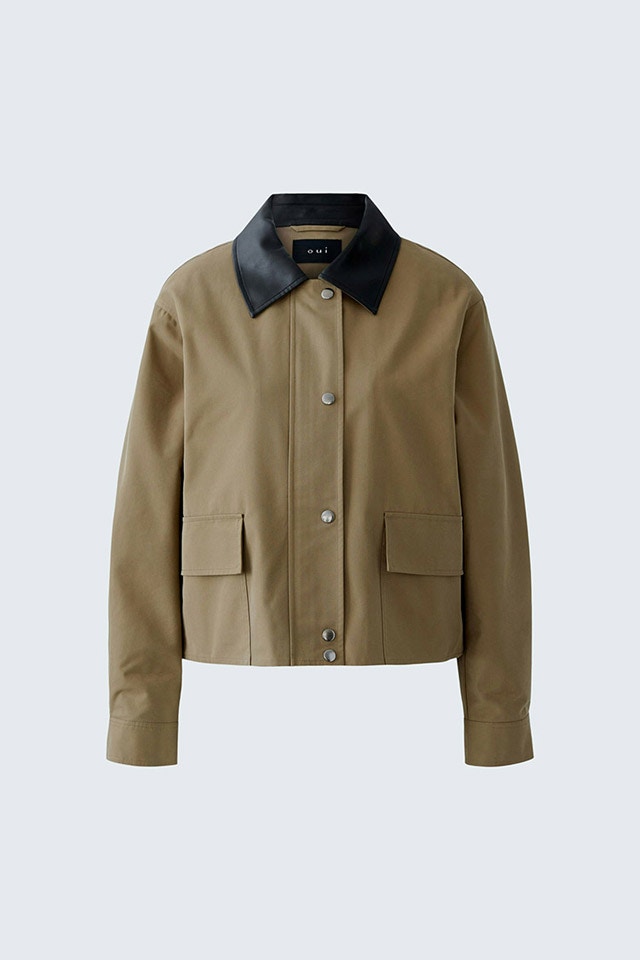 A khaki-coloured jacket with a black collar.