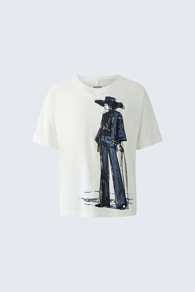 A white T-shirt with a cowgirl print.