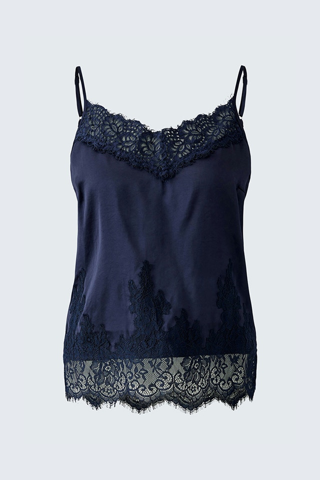 A blue strappy top with lace at the hem.