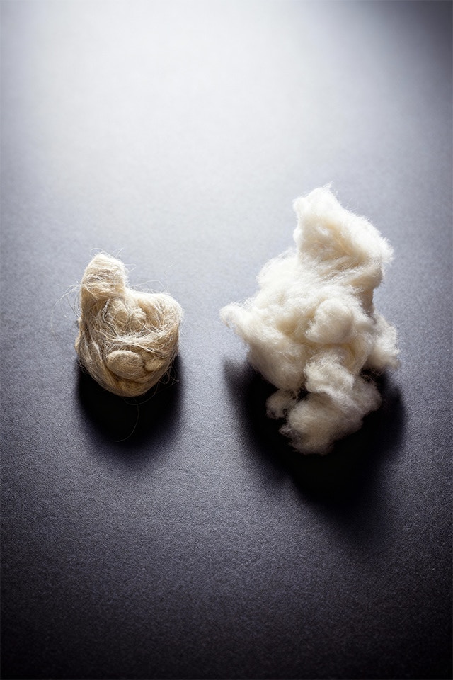 Two balls of yarn are shown, one made of cotton and the other a fluffy ball of cashmere.