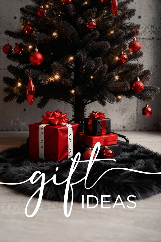 A Christmas tree with red decorations, underneath are gifts wrapped in red and black with a Oui logo bow.