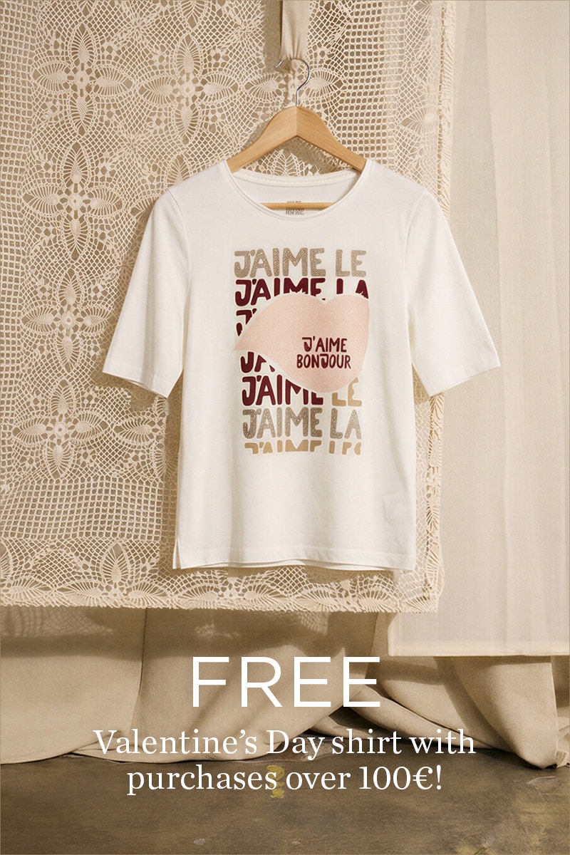 T-shirt on hanger in white with pink and red print with heart. Refers to a free promotion.