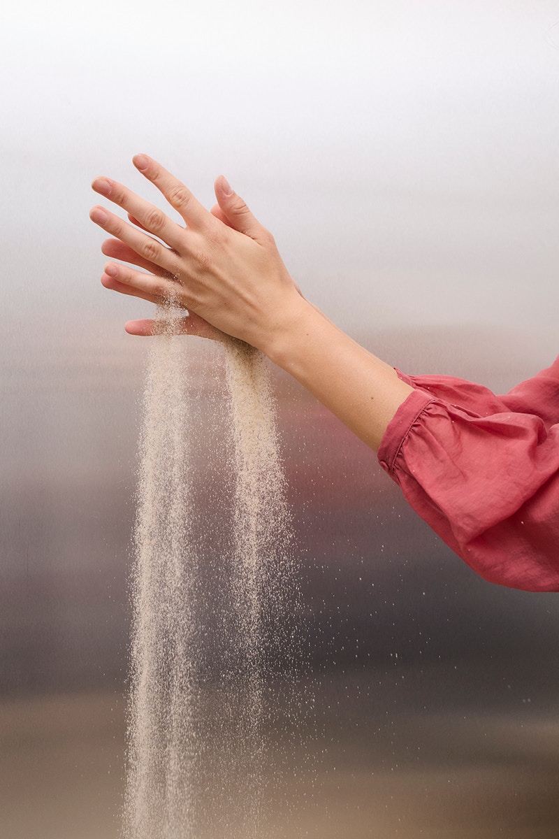 Sand runs through your hands.