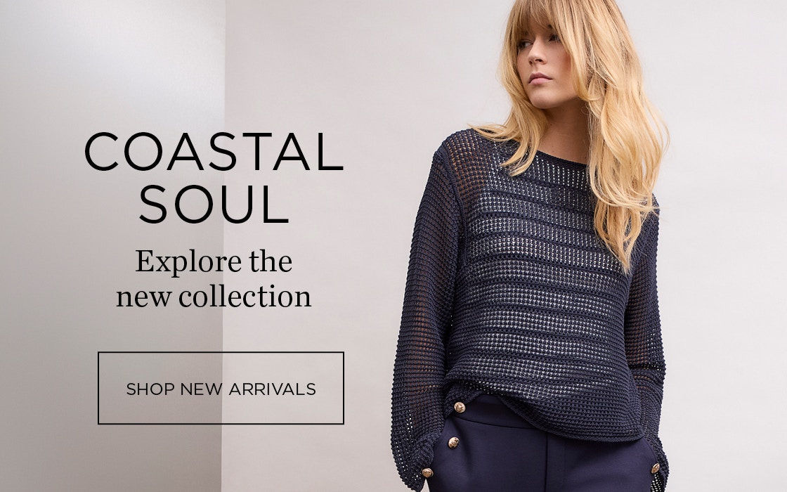 Woman on the right wearing a dark blue jumper and matching trousers. Text on the right: Coastal Soul - Explore the new collection with click button shop new arrivals
