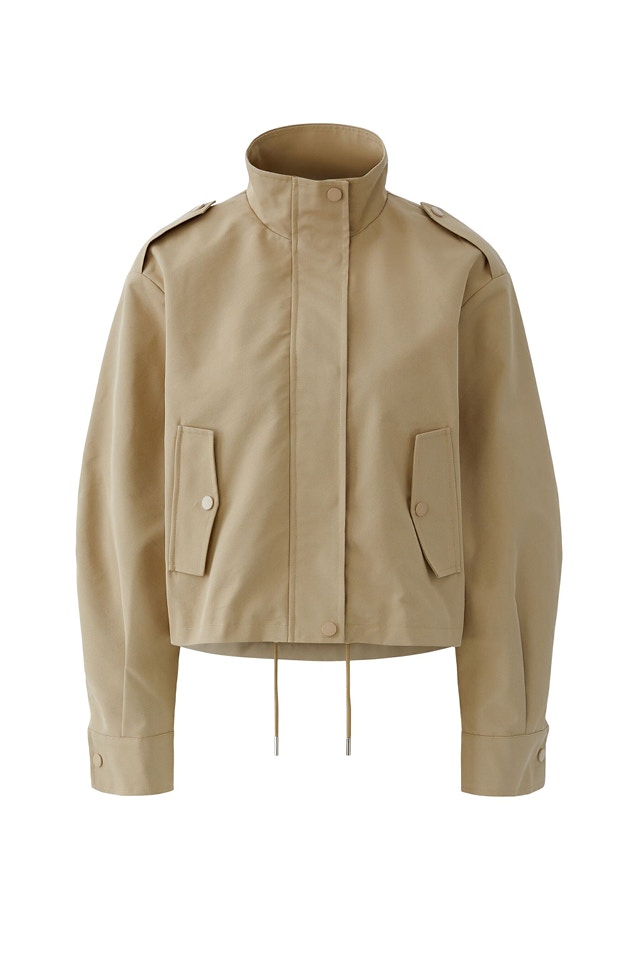 Beige Jacke.