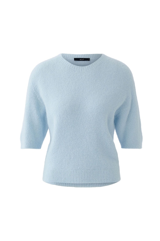 Light blue knitted jumper with short sleeves.