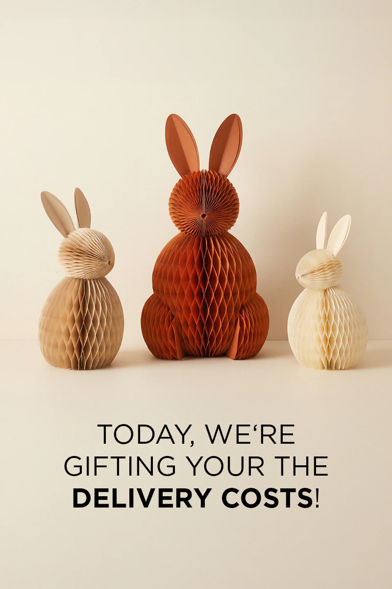 Three paper bunnies in beige, red and orange, with the text: We’re covering the delivery costs for you today