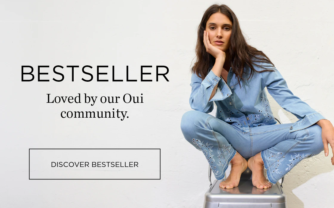 A woman is crouching on a chair, wearing a denim shirt and jeans. On the left it says: Bestsellers – loved by our Oui community. Clickable area: Discover bestseller