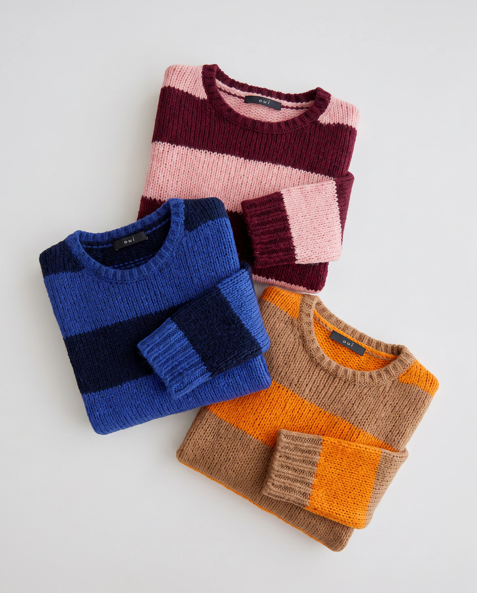 Oui Essentials: Three striped knitted jumpers in burgundy and pink, blue and navy, and beige and orange