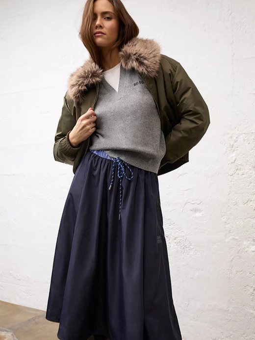 Women’s fashion from Oui, featuring a bomber jacket, knitted jumper and midi skirt