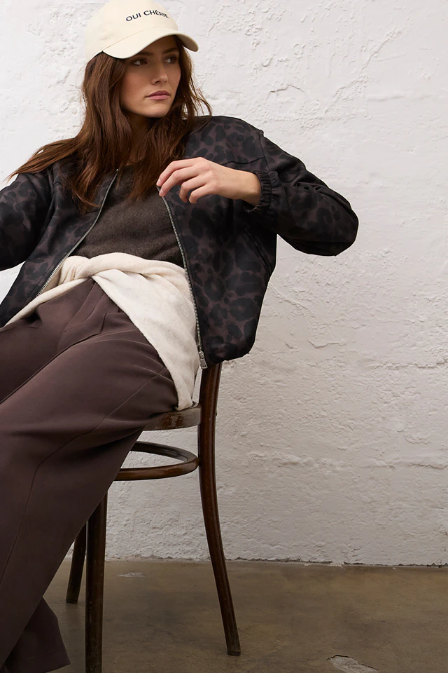 Women’s fashion from Oui, featuring a leopard-print jacket, jumper, cardigan and trousers.